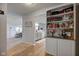 Open-concept living room and kitchen featuring modern decor and abundant natural light at 7150 Brant Pointe Cir, Indianapolis, IN 46217