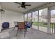 Enclosed porch featuring outdoor seating and views of the backyard at 7150 Brant Pointe Cir, Indianapolis, IN 46217