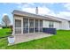 Enclosed screen porch showcasing a brick patio, outdoor seating, and a view of the home's exterior at 7150 Brant Pointe Cir, Indianapolis, IN 46217