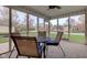 Enclosed porch with a dining set, perfect for outdoor relaxation at 7150 Brant Pointe Cir, Indianapolis, IN 46217