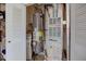 Utility closet featuring a hot water tank, shelving, and other mechanicals at 7150 Brant Pointe Cir, Indianapolis, IN 46217