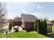 Spacious backyard with a patio, seating area, grill, and well-maintained lawn at 7322 Franklin Parke Ct, Indianapolis, IN 46259