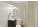 Well-lit bathroom featuring a modern vanity, mirror, toilet, and a walk-in shower at 7322 Franklin Parke Ct, Indianapolis, IN 46259