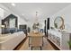 Open-concept dining room featuring modern lighting, furniture, and hardwood floors at 7322 Franklin Parke Ct, Indianapolis, IN 46259