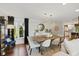 Dining room featuring a wooden table, bright chandelier, and hardwood floors at 7322 Franklin Parke Ct, Indianapolis, IN 46259