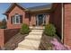 Inviting front entrance with well-maintained landscaping, planters and a welcoming front door at 7322 Franklin Parke Ct, Indianapolis, IN 46259