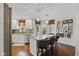 Kitchen with island and seating, granite countertops, stainless steel appliances, and hardwood floors at 7322 Franklin Parke Ct, Indianapolis, IN 46259