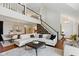 Bright living room with soaring ceilings and hardwood floors at 7322 Franklin Parke Ct, Indianapolis, IN 46259