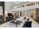 Bright living room with soaring ceilings, fireplace, and hardwood floors at 7322 Franklin Parke Ct, Indianapolis, IN 46259