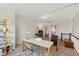 Bright loft space featuring a desk, decorative shelves, and a view into adjacent rooms at 7322 Franklin Parke Ct, Indianapolis, IN 46259