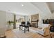 Bright home office featuring a fireplace, desk, chair, and a comfortable seating area at 7322 Franklin Parke Ct, Indianapolis, IN 46259