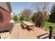 Expansive patio with a large dining table and built-in grill, ideal for outdoor gatherings at 7322 Franklin Parke Ct, Indianapolis, IN 46259