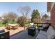Outdoor patio offers comfortable seating, a fire pit, and dining space, perfect for entertaining at 7322 Franklin Parke Ct, Indianapolis, IN 46259