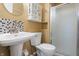 Bathroom featuring updated fixtures, modern sink, and standing shower at 745 W Banta Rd, Indianapolis, IN 46217