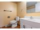 This bathroom boasts a modern vanity with a white countertop, a toilet, and updated fixtures for convenience at 745 W Banta Rd, Indianapolis, IN 46217