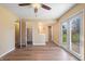 Large bedroom with a ceiling fan and sliding glass doors with access to an outdoor deck at 745 W Banta Rd, Indianapolis, IN 46217