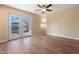 Bright, expansive bedroom with ceiling fan and sliding glass doors to outdoor deck at 745 W Banta Rd, Indianapolis, IN 46217