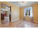 Bright dining room with hardwood floors and a large window with view of backyard at 745 W Banta Rd, Indianapolis, IN 46217