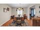 Bright dining room features a large wooden table with seating for eight, a stylish rug and window blinds at 758 Stafford Rd, Plainfield, IN 46168