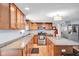Well-lit kitchen featuring granite countertops, stainless steel appliances, and a functional center island at 758 Stafford Rd, Plainfield, IN 46168