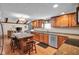 Spacious kitchen with granite countertops, stainless appliances, island with seating and seamlessly connected to the living room at 758 Stafford Rd, Plainfield, IN 46168