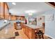 Spacious kitchen features granite countertops, stainless appliances, and a functional island, perfect for cooking at 758 Stafford Rd, Plainfield, IN 46168
