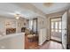 Bright living room entrance with wood-look flooring and view into the dining room; natural light streams in at 758 Stafford Rd, Plainfield, IN 46168