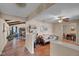 Inviting living room with wood floors, neutral walls, and a cozy seating area; flows to the dining area and other rooms at 758 Stafford Rd, Plainfield, IN 46168