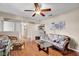Cozy living room showcasing wood-look floors, neutral walls, and decorative shelving, all filled with natural light at 758 Stafford Rd, Plainfield, IN 46168