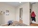 A multi-purpose space in neutral tones with space for computing and a view into an adjacent half bathroom at 758 Stafford Rd, Plainfield, IN 46168