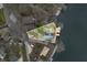 Aerial view of a property highlighting its landscaped yard, private dock, and direct access to the serene lake at 7591 Inkbush Dr, Nineveh, IN 46164