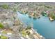 Panoramic aerial view of lakefront homes surrounded by mature trees, showing neighborhood layout and waterfront access at 7591 Inkbush Dr, Nineveh, IN 46164