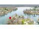 Scenic aerial view of lakefront homes, highlighting the property's prime location on the water with mature trees at 7591 Inkbush Dr, Nineveh, IN 46164