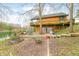 Waterfront log home with large patio, lush yard, and easy lake access at 7591 Inkbush Dr, Nineveh, IN 46164