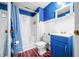 Bright bathroom featuring a white shower, anchor-themed decor, and charming blue accents throughout at 7591 Inkbush Dr, Nineveh, IN 46164