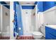 Well-lit bathroom with blue accents, a shower, and a vanity at 7591 Inkbush Dr, Nineveh, IN 46164