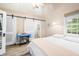 Bedroom featuring wood floors, natural light, and a sliding barn door to an ensuite bathroom at 7591 Inkbush Dr, Nineveh, IN 46164