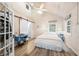 Cozy bedroom with a vintage Singer sewing table and lots of natural light at 7591 Inkbush Dr, Nineveh, IN 46164