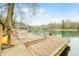 Picturesque dock featuring seating and a tranquil lake view, perfect for relaxing and enjoying waterfront living at 7591 Inkbush Dr, Nineveh, IN 46164