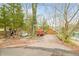 Charming log cabin exterior view with American flag and lake access at 7591 Inkbush Dr, Nineveh, IN 46164