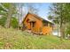 Charming log cabin home with a cozy front porch and a view of the lake at 7591 Inkbush Dr, Nineveh, IN 46164