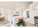 Bright kitchen with white cabinets, butcher block countertops, and an open doorway at 7591 Inkbush Dr, Nineveh, IN 46164