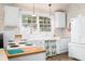 Bright kitchen featuring white cabinets, vintage sink and appliances for a classic look at 7591 Inkbush Dr, Nineveh, IN 46164
