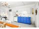 Bright and airy kitchen featuring blue cabinets and white appliances at 7591 Inkbush Dr, Nineveh, IN 46164