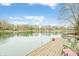 Expansive lake view from the dock showcasing calm waters and waterfront properties, offering a serene and picturesque setting at 7591 Inkbush Dr, Nineveh, IN 46164