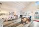 Inviting living room with wood floors, vaulted ceilings, and lots of natural light, creates a cozy and airy space at 7591 Inkbush Dr, Nineveh, IN 46164
