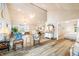 Spacious living room with wood floors, vaulted ceilings, and ample seating, perfect for entertaining and relaxing at 7591 Inkbush Dr, Nineveh, IN 46164