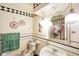 Charming bathroom with decorative tiles, unique lighting fixtures, and vintage-inspired decor at 7714 Kenneth Ct, Brownsburg, IN 46112