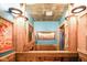 Unique rustic bathroom with corrugated metal ceiling and wood accents at 7714 Kenneth Ct, Brownsburg, IN 46112