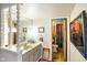 Well-lit bathroom featuring unique design elements and connecting toilet room at 7714 Kenneth Ct, Brownsburg, IN 46112